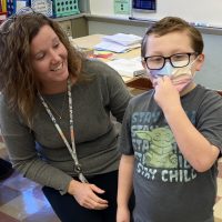 Quakertown Elementary School Wendy Stefenack speaks with a student in a QE classroom.