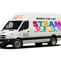 A transit van is shown with the Bucks IU logo and graphics showing it as the Mobile Fab Lab for STEAM Education